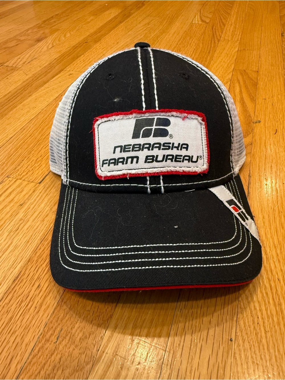 Nebraska Farm Bureau Black and White Trucker Hat